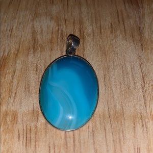 Egg shaped blue stone pendant